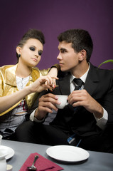 The man in love at restaurant with the girl the Punk