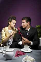 The girl sets fire to the rose presented