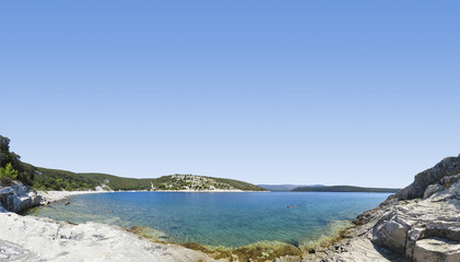 panoramic view of a beautiful rocky beach in croatia, blue sea