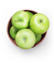 green apple in wooden bowl