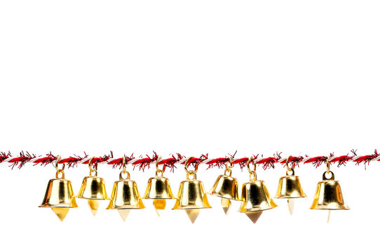 Golden bell holding ribbon rope on white background
