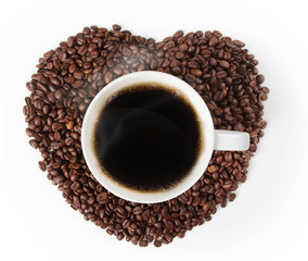 Cup of hot coffee on a Heart shape made from coffee