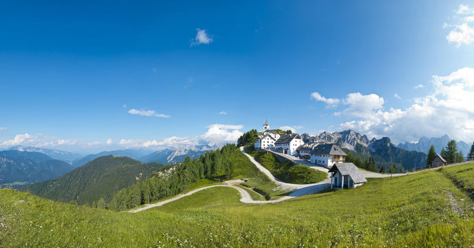 panoramic view of monte lussari, small mountain village, italy