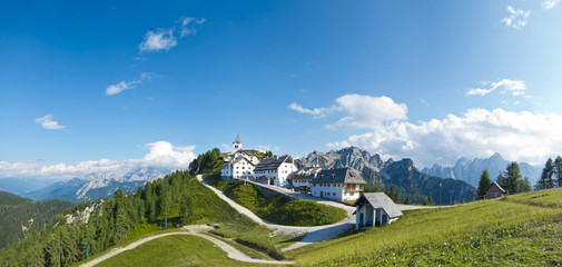 panoramic view of monte lussari, small mountain village, italy
