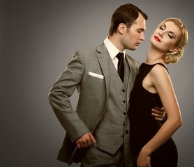 Retro couple isolated on grey background