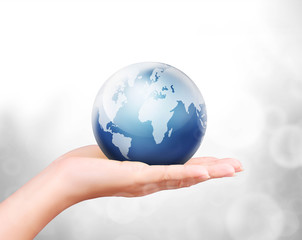 Globe ,earth in human hand against