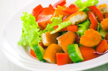 fresh vegetable salad with nuggets