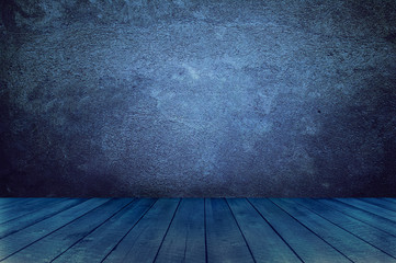 Empty room with wooden floor and concrete wall