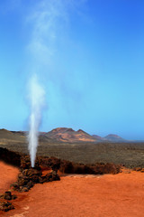 Geyser of steam in Timanfaya Park Lanzarote