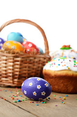 Obraz na płótnie Canvas Easter eggs, cake, basket