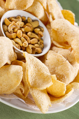 crisp cracker, dish of crispy rice and fried nuts