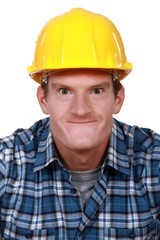 Tradesman making a silly face