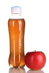 Delicious apple juice in plastic bottle and apple next to it