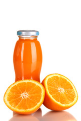 Delicious orange juice in a bottle and orange next to it
