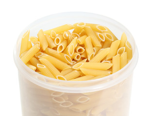 Uncooked penne pasta in plastic holder