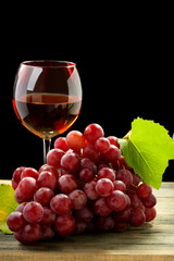Bunch of grapes and glass of wine.