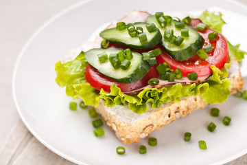 Sandwich with ham and vegetables