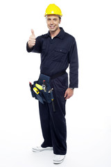Industrial contractor gesturing thumbs up