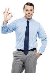 Team leader gesturing okay sign to his subordinates