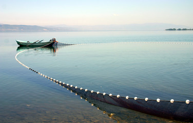 Fishing boad on lake at Iznik - obrazy, fototapety, plakaty