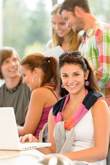 High-school study group learning in library class