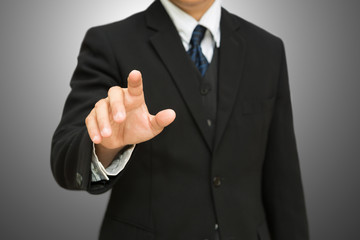 Businessman pushing on the whiteboard