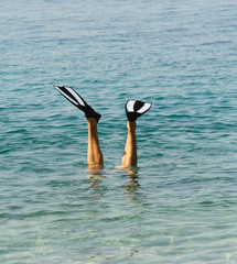 Legs with flippers -- free diver