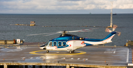 Fototapeta na wymiar Passenger helicopter waiting to take off