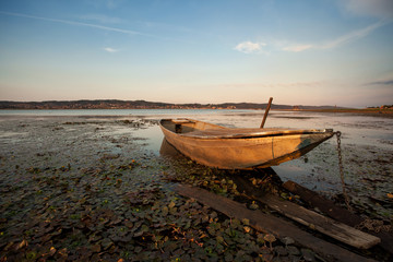 old boat and blue lake