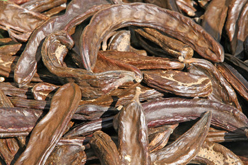 many carob dried Brown for sale to the market