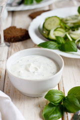 Obraz na płótnie Canvas Yogurt sauce for a green summer salad