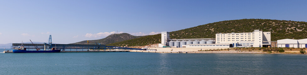 Panorama of a large mill plant with port