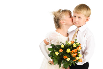 5-7 years old girl kissing a boy, studio shot, formal wear