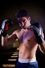 fit fighter with boxing gloves