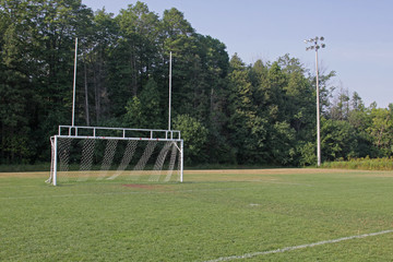 A view of the goal on a vacant soccer pitch..