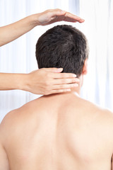 Hand Massaging Man's Head