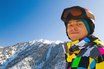 Sport man in snowy mountains