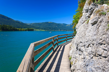 Wooden walkway along beautiful Wolfgang lake, Austria