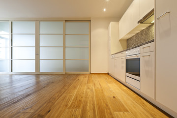 interior empty house with wooden floor, kitchen