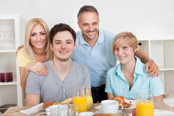 Happy family enjoying breakfast