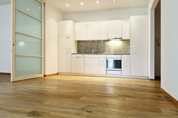 interior empty house with wooden floor, kitchen view