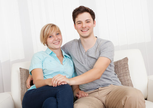 Loving couple relaxing on a sofa