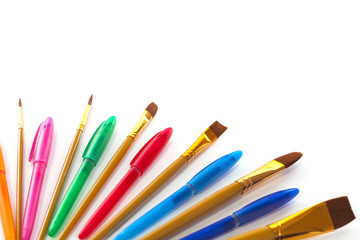 Artist brushes and coloured pens