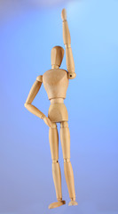 wooden mannequin, on blue background