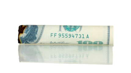 Cigar of the 100 dollar bill isolated on white