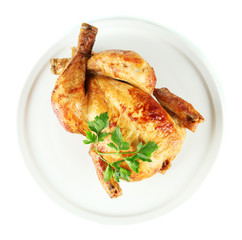Roasted whole chicken on a white plate isolated on white