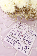 wedding invitations on decorated table close-up