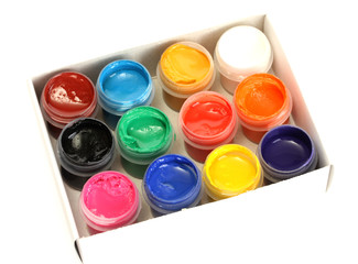 jars with colorful gouache in paper box