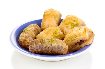 Sweet baklava on plate isolated on white