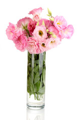 bouquet of eustoma flowers in vase, isolated on white